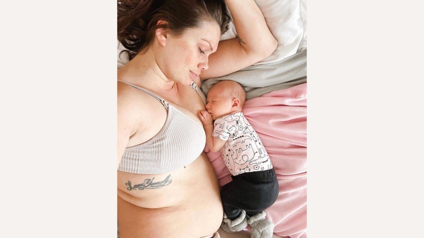 mama and baby lying on bed