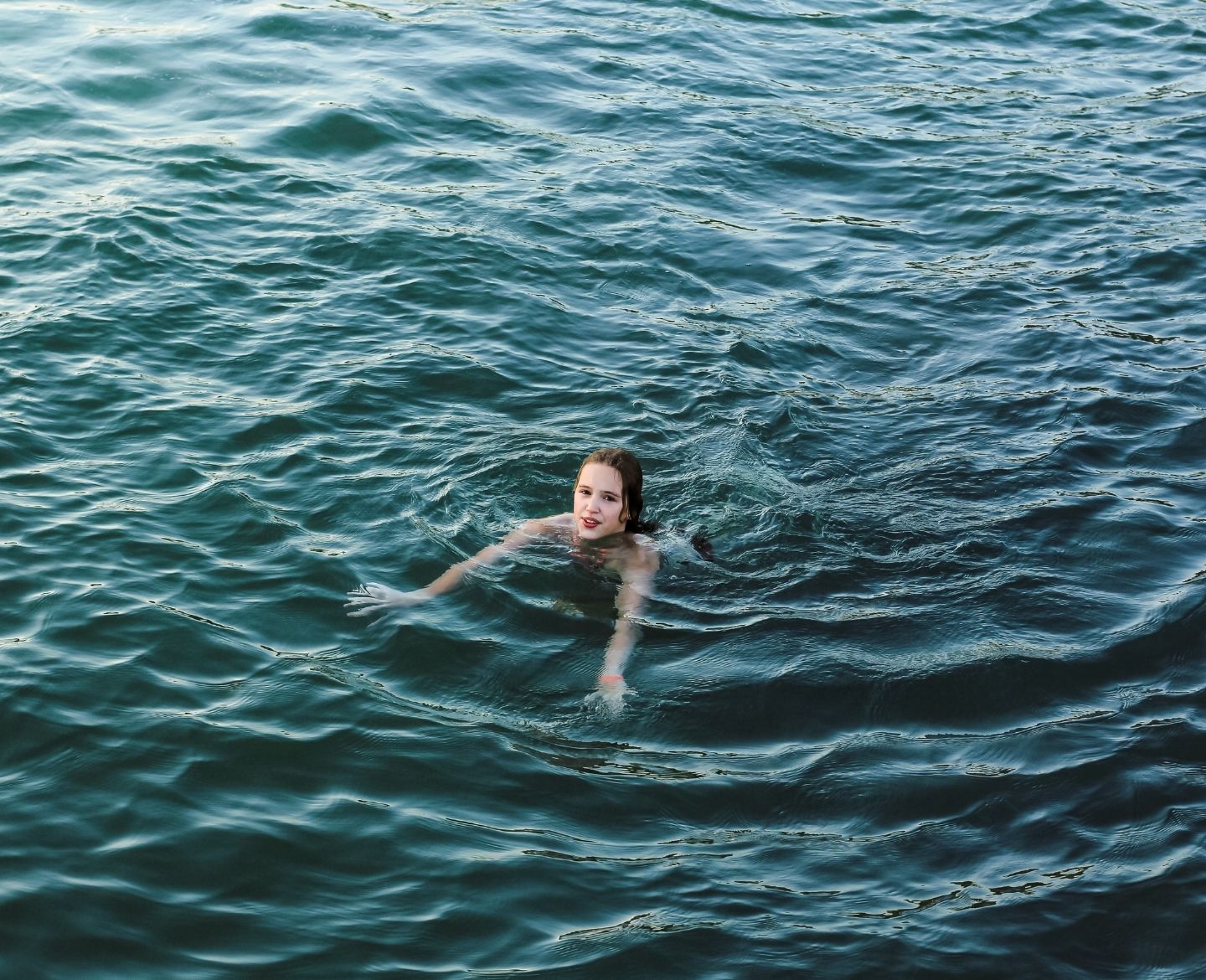 teen drowning prevention: teen girl swimming in ocean