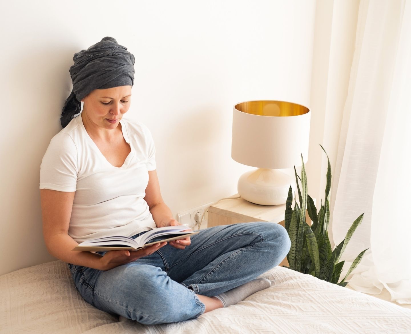 woman reading book - parenting books for toddlers