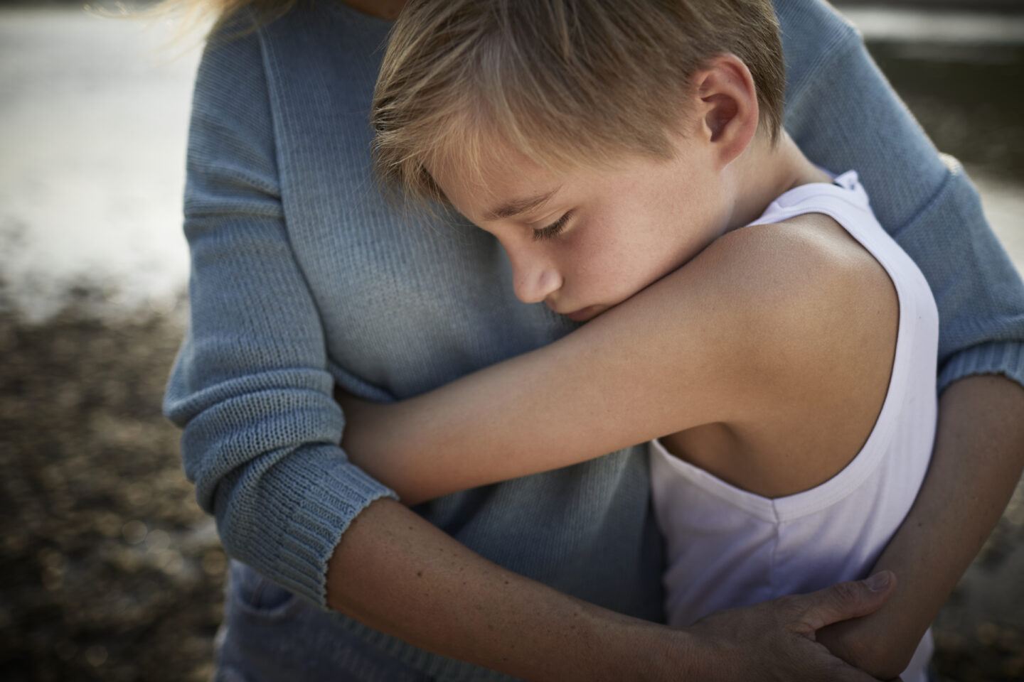 sunday scaries: mother hugging son outside