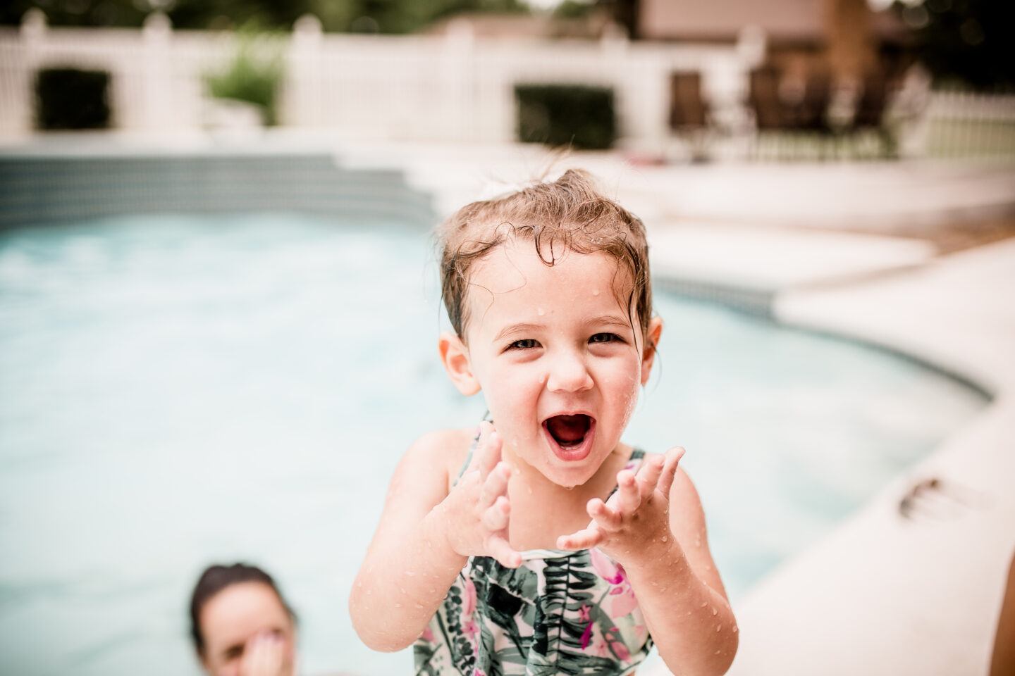 water safety: toddler excited at pool