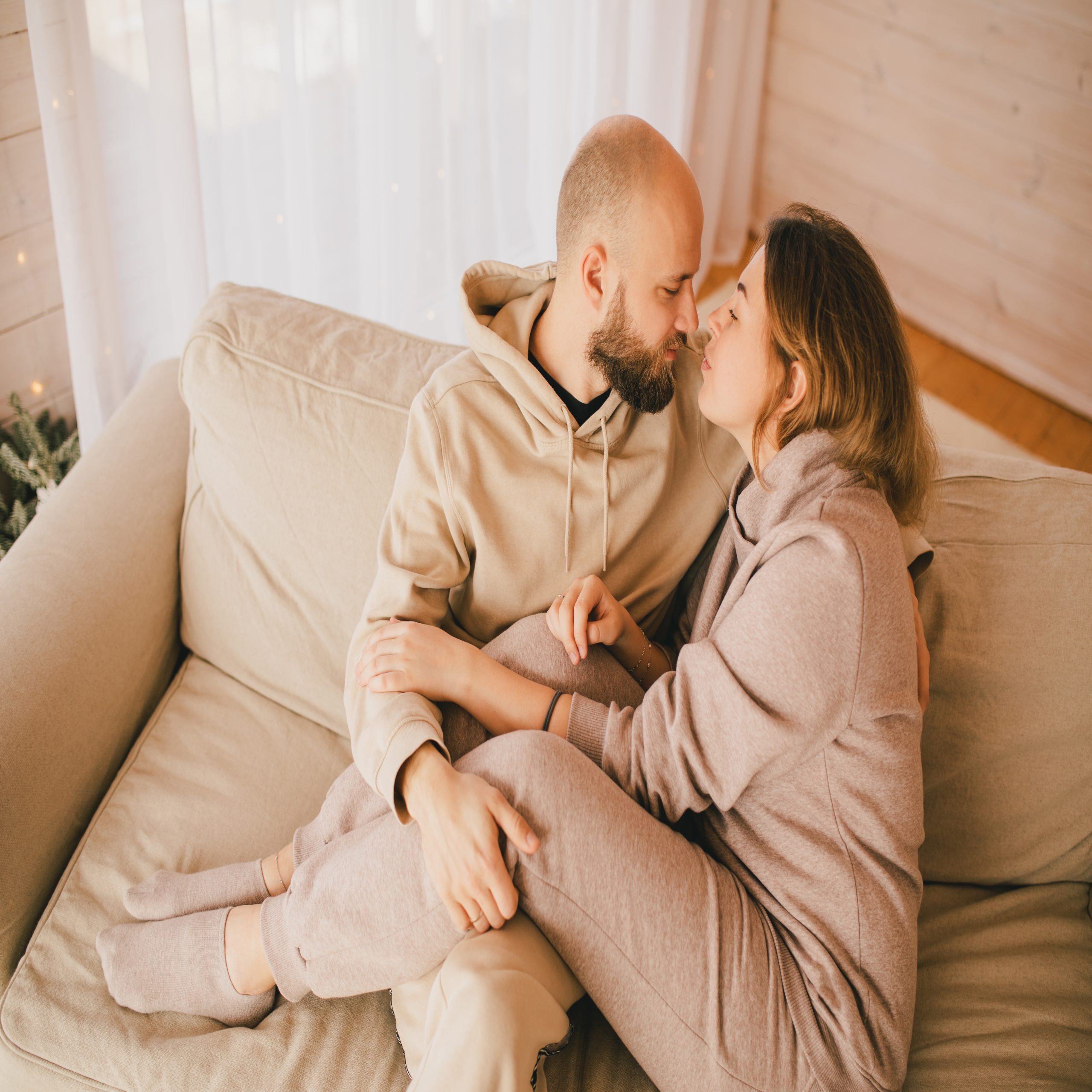 husband and wife sitting on couch