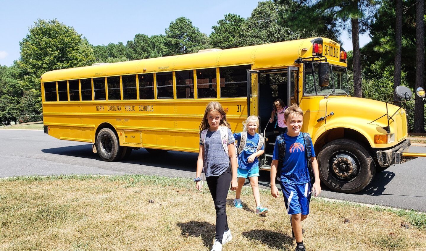 Kids getting off school bus