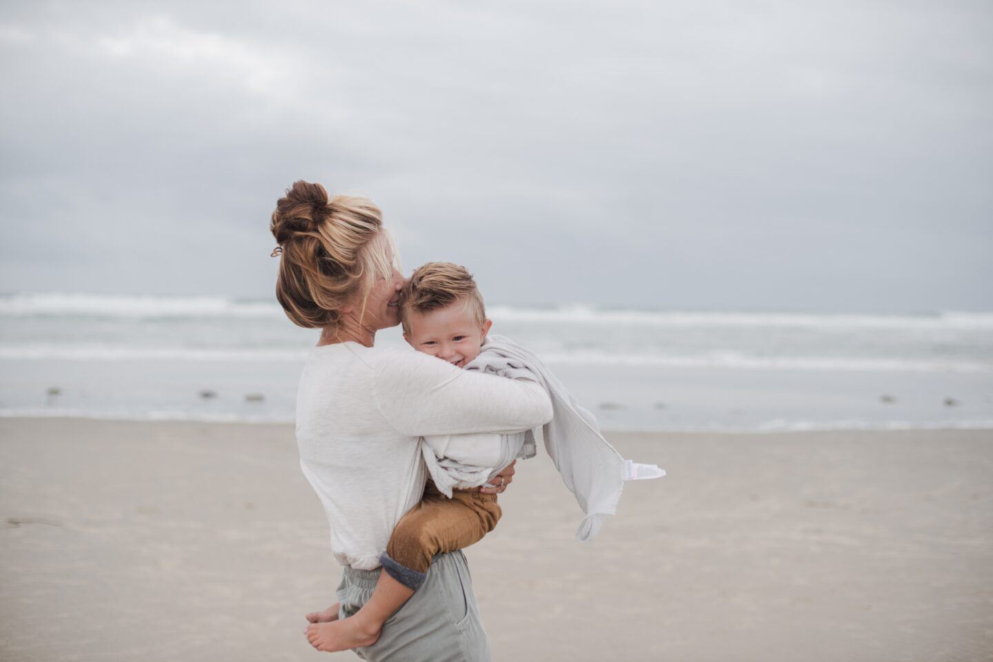 motherhood: little boy in his mom's arms