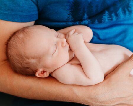 middle age caucasian happy proud father holding newborn baby girl daughter on arms hands dad hugging t20 Nl2y4n Motherly