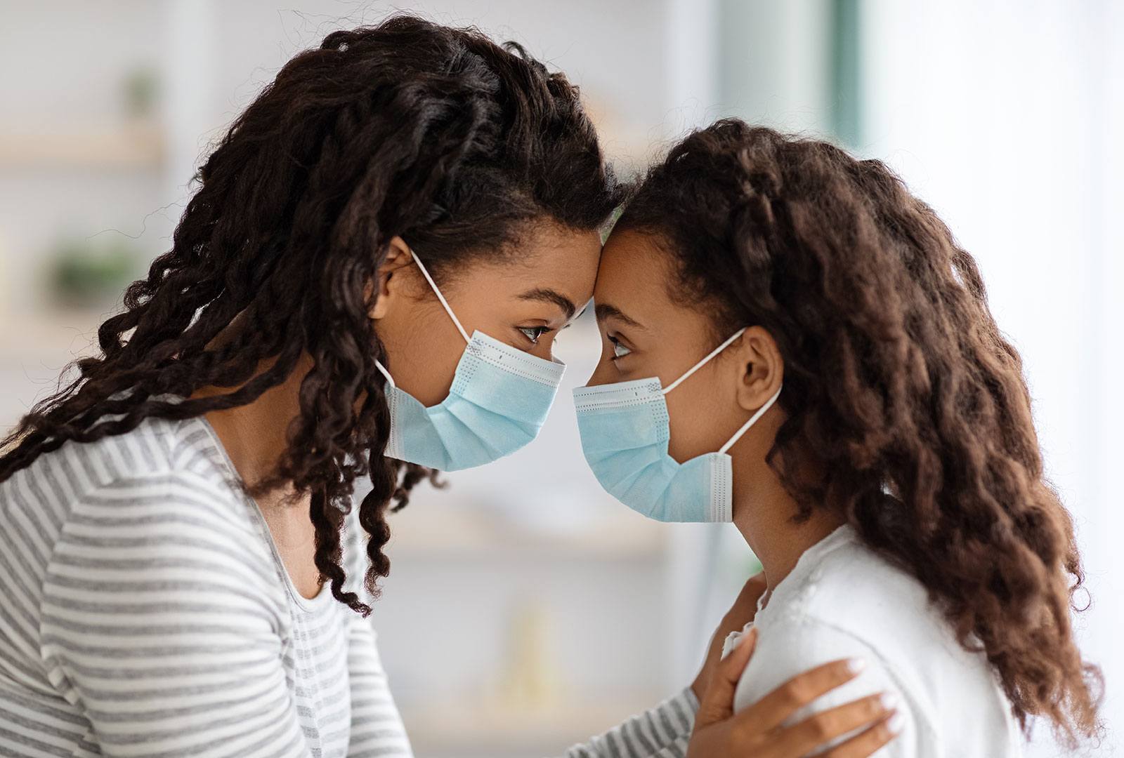 Mom and daughter wearing face masks