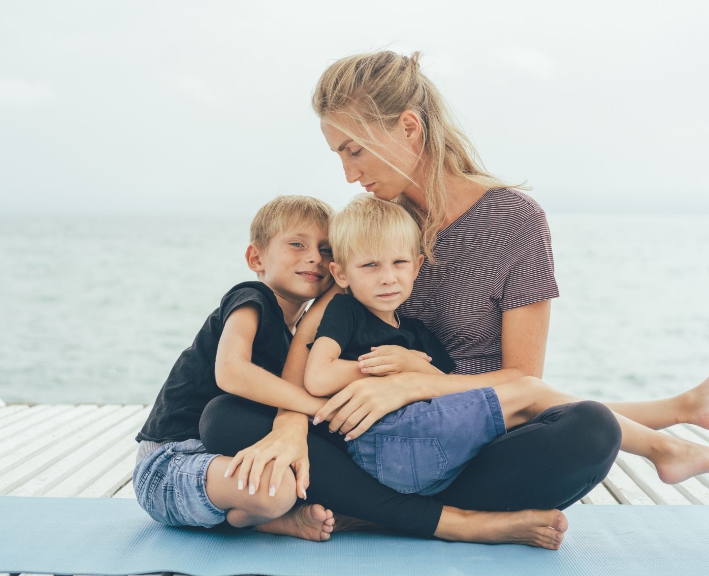 mom hugging boys Motherly