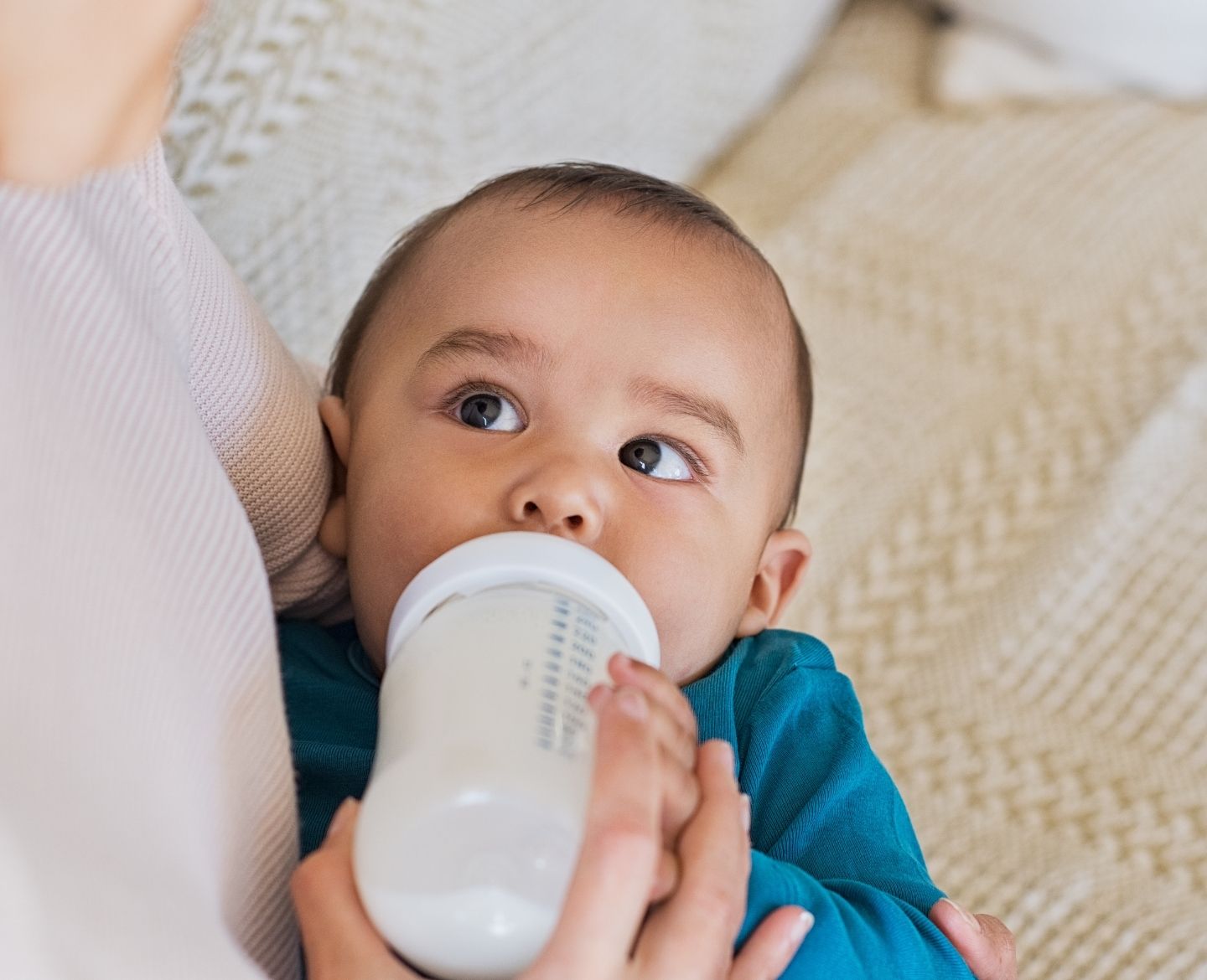 infant formula shortage: baby drinking formula from bottle