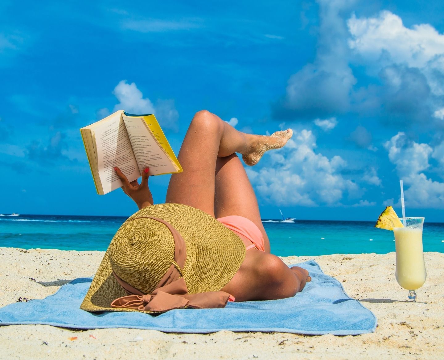 woman on beach reading