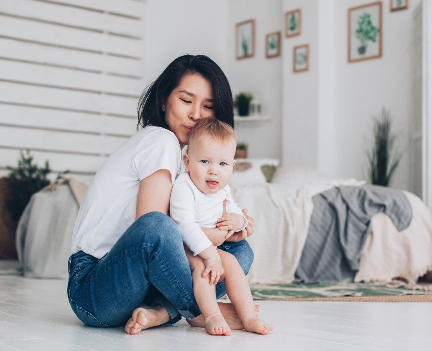 young mother holding her infant son