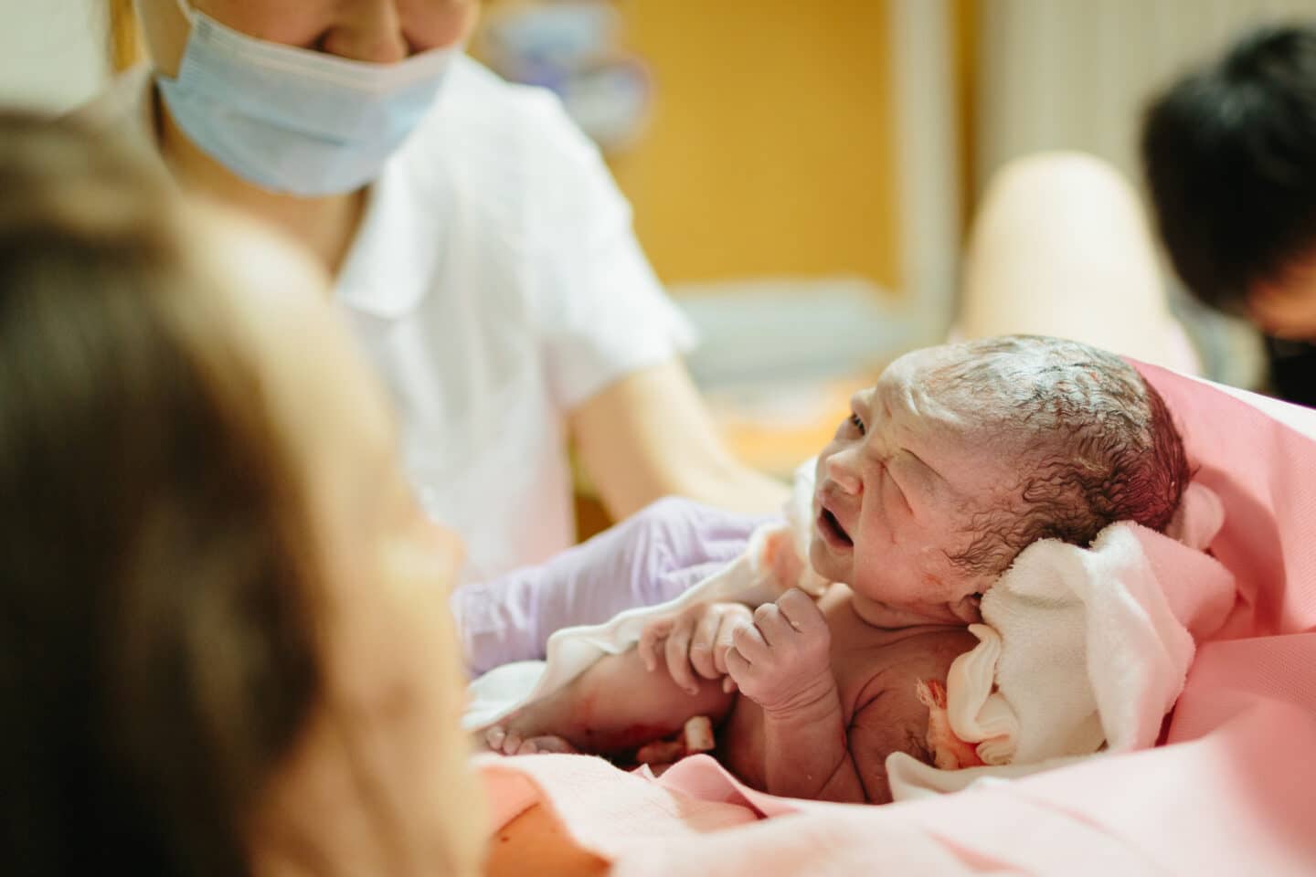 newborn baby crying after delivery