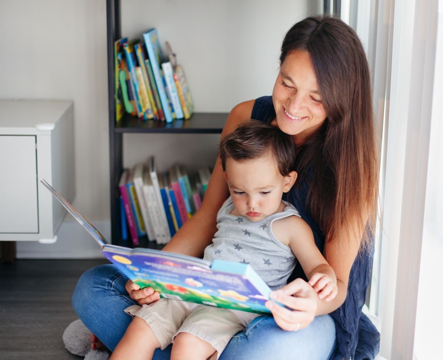 mom reading with toddler son