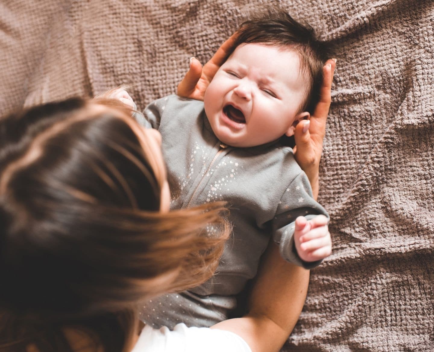 mom and baby on the bed Motherly