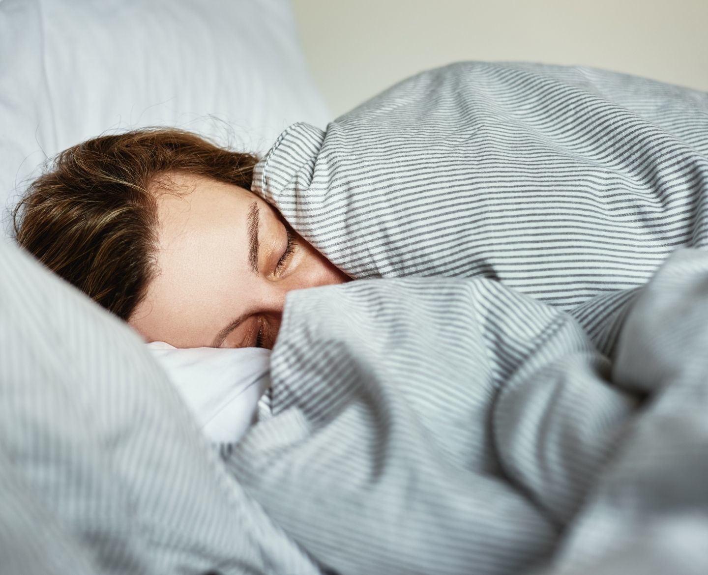 mom sleeping in bed alone