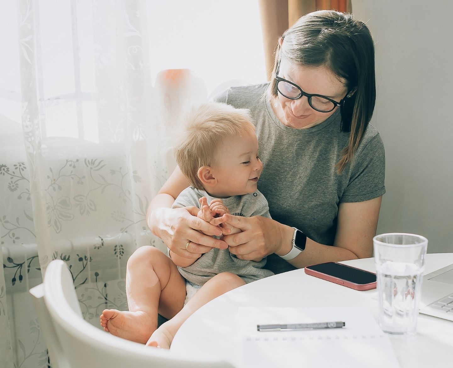 mom and baby sitting at table