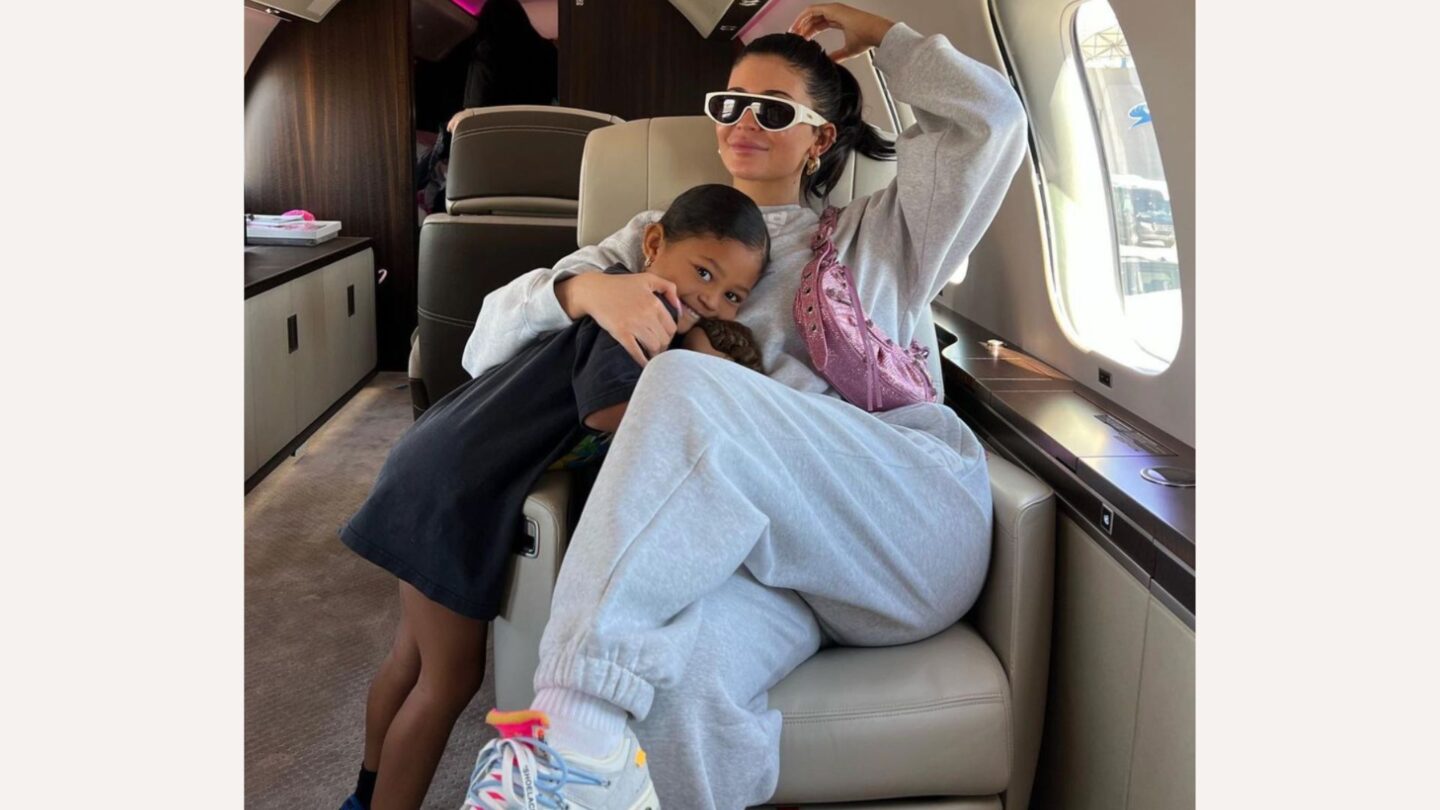 Kylie Jenner sitting on airplane with Stormi