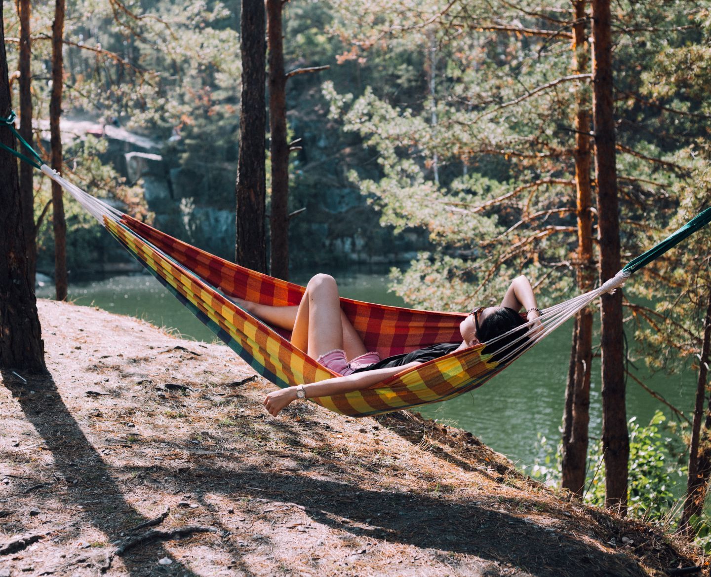 woman laying in hammock