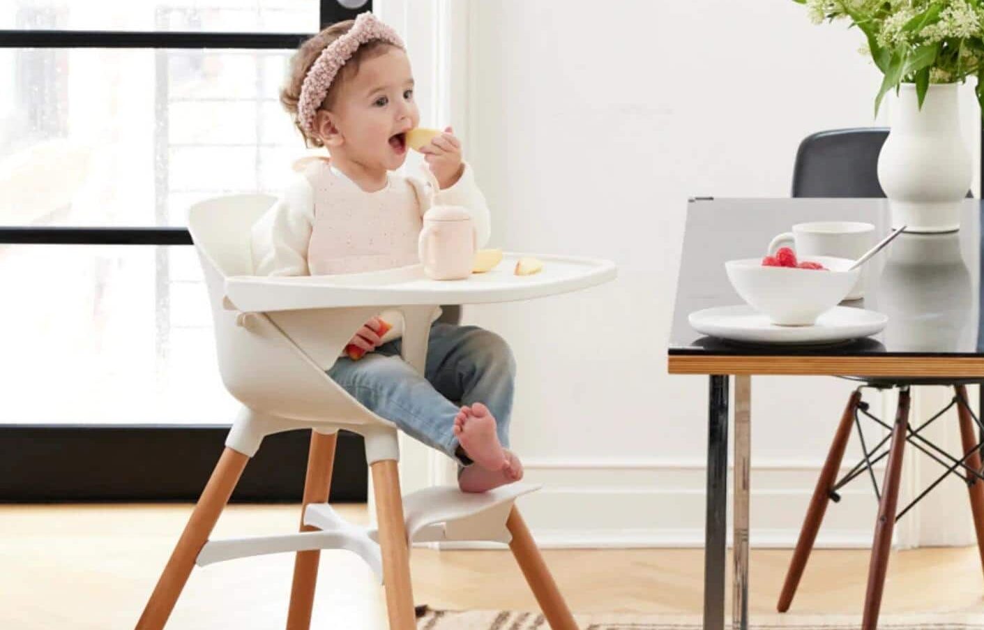 little girl in high chair