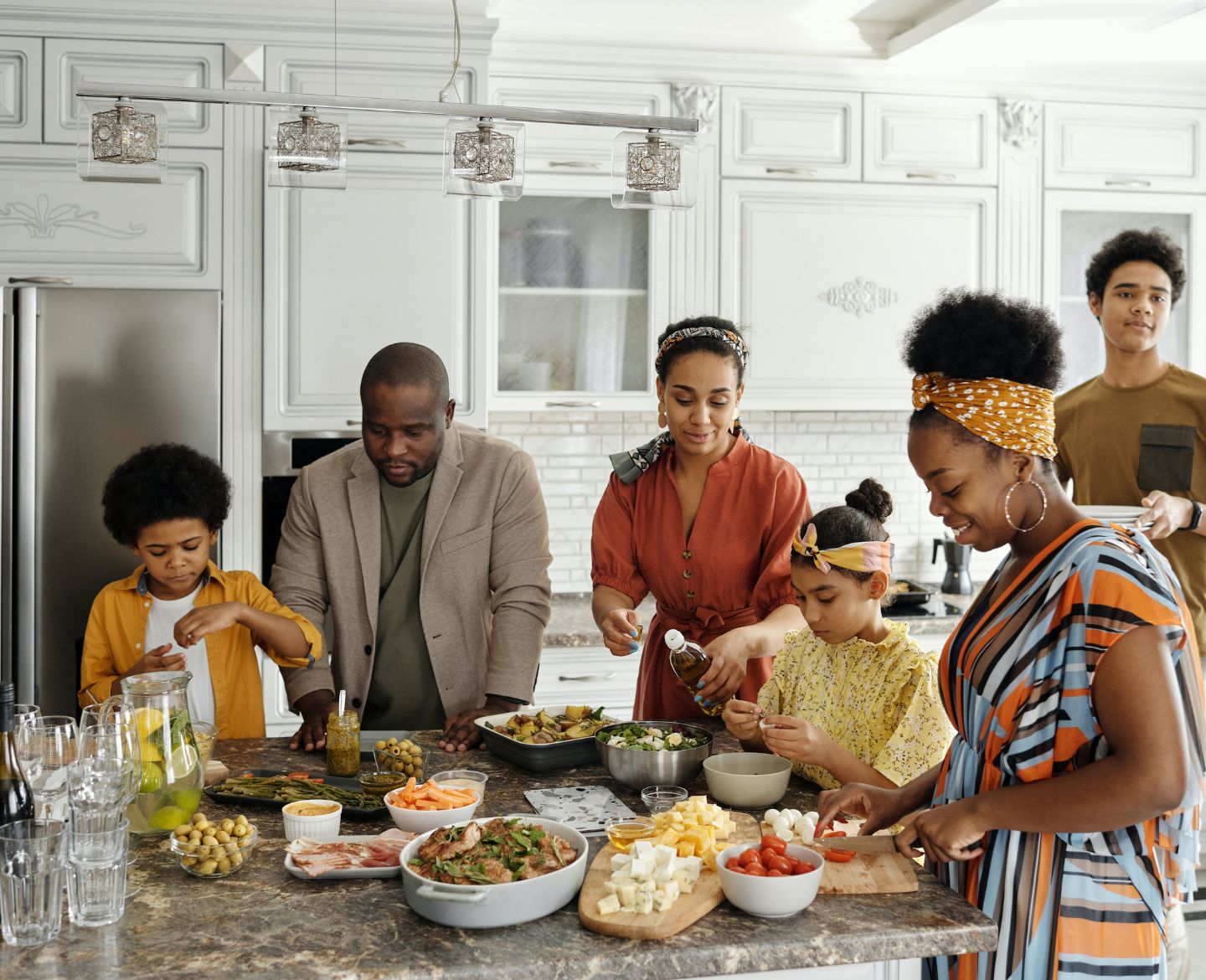 family standing around kitchen counter- adult sibling relationships