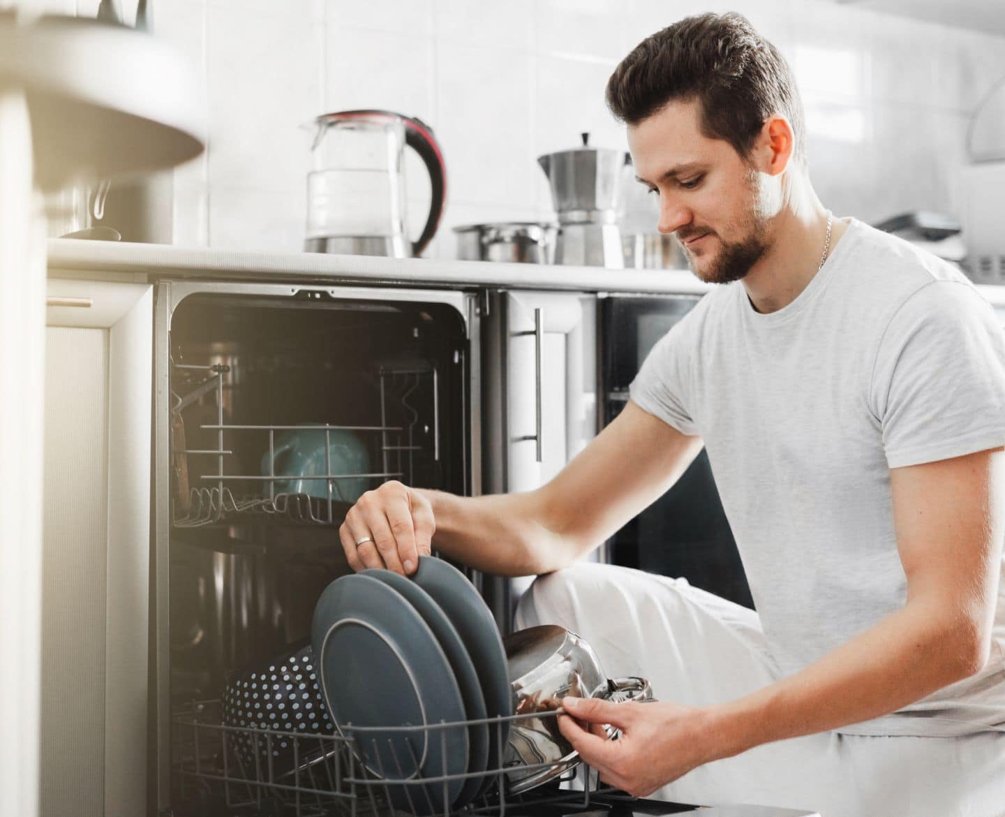 husband loading dishwasher