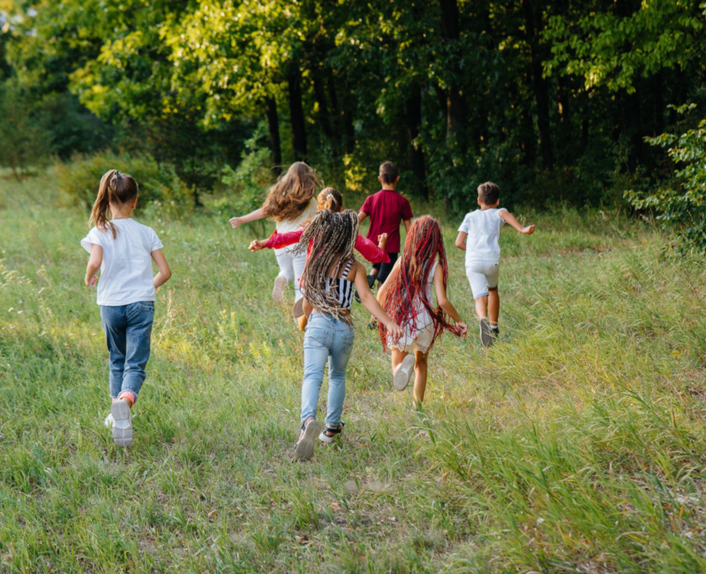 Sandlot summer: kids running in an open field