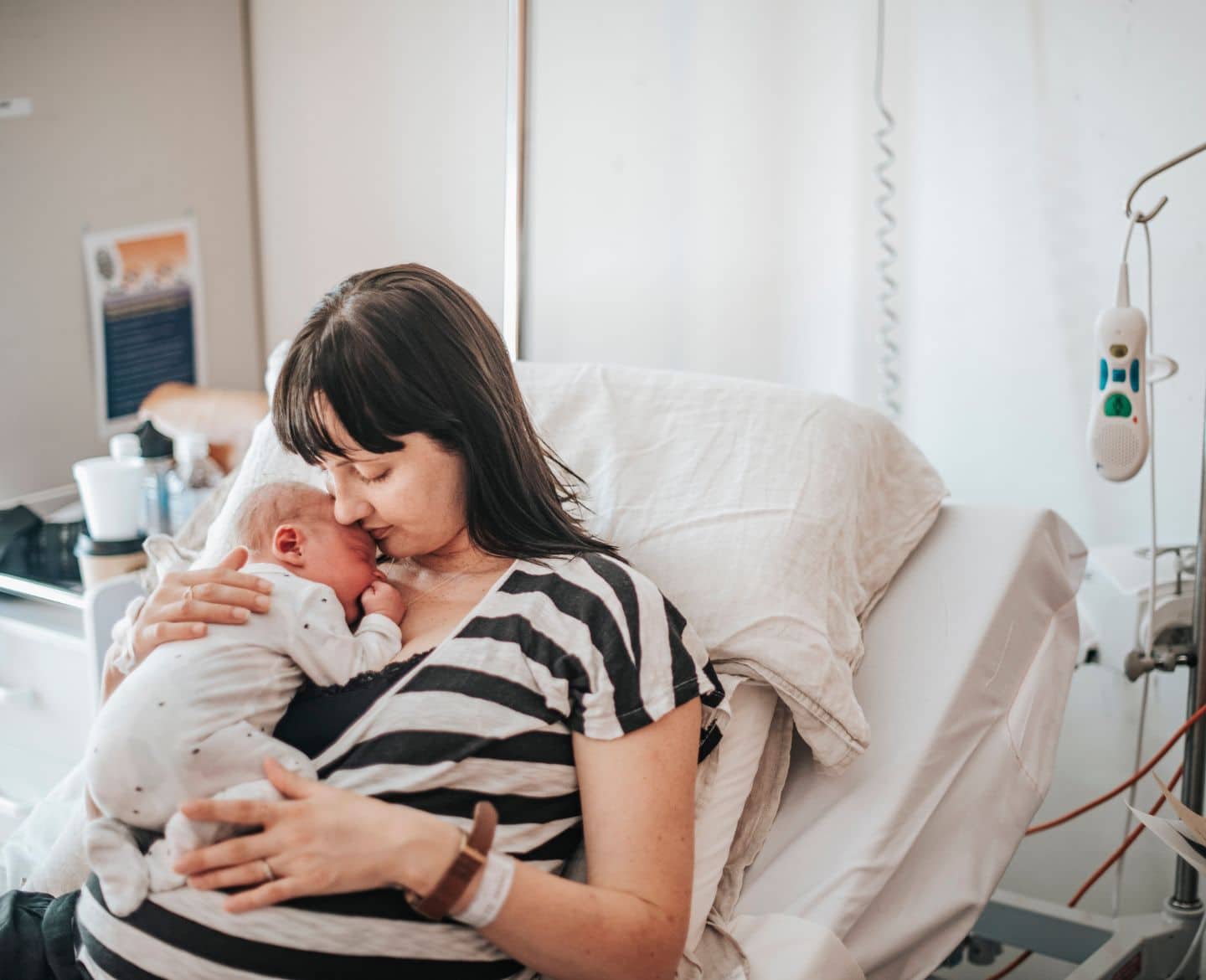 mom holding baby in hospital