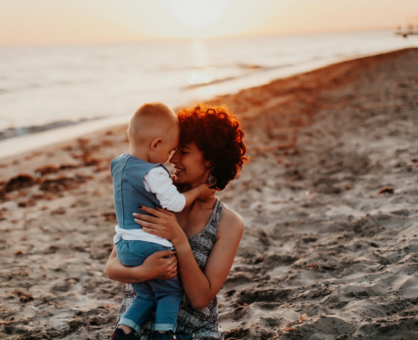 single mom: mom with son on beach