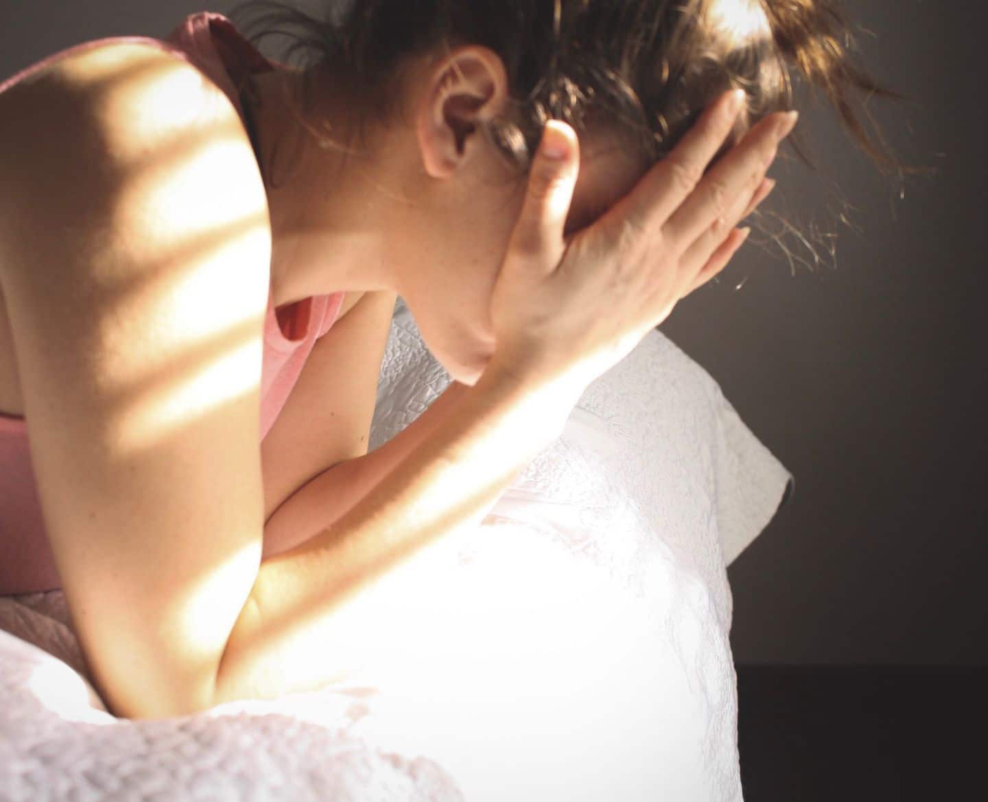 upset woman head in hands Motherly