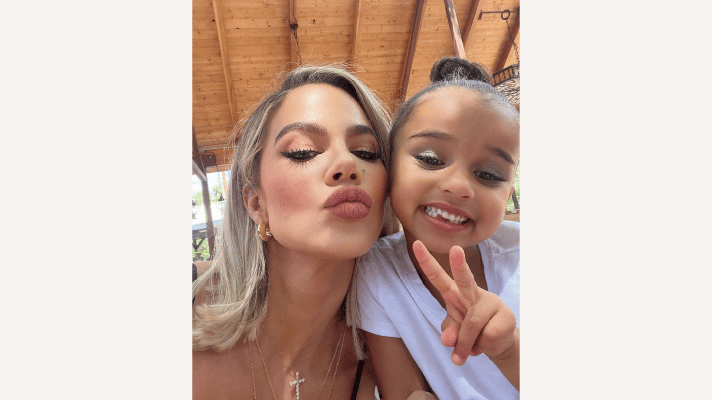 khloe kardashian posing with daughter True