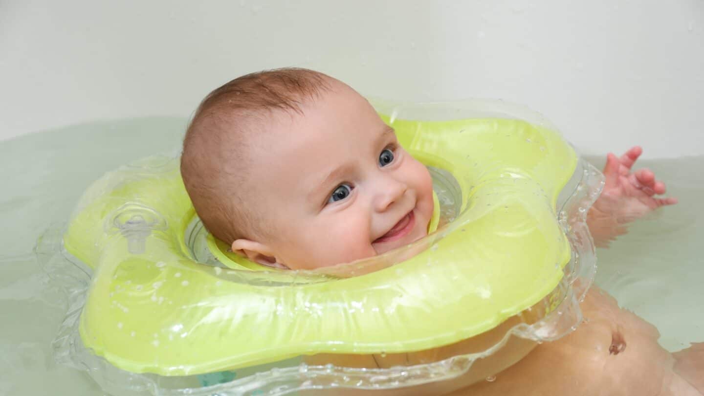 baby in neck flotation device