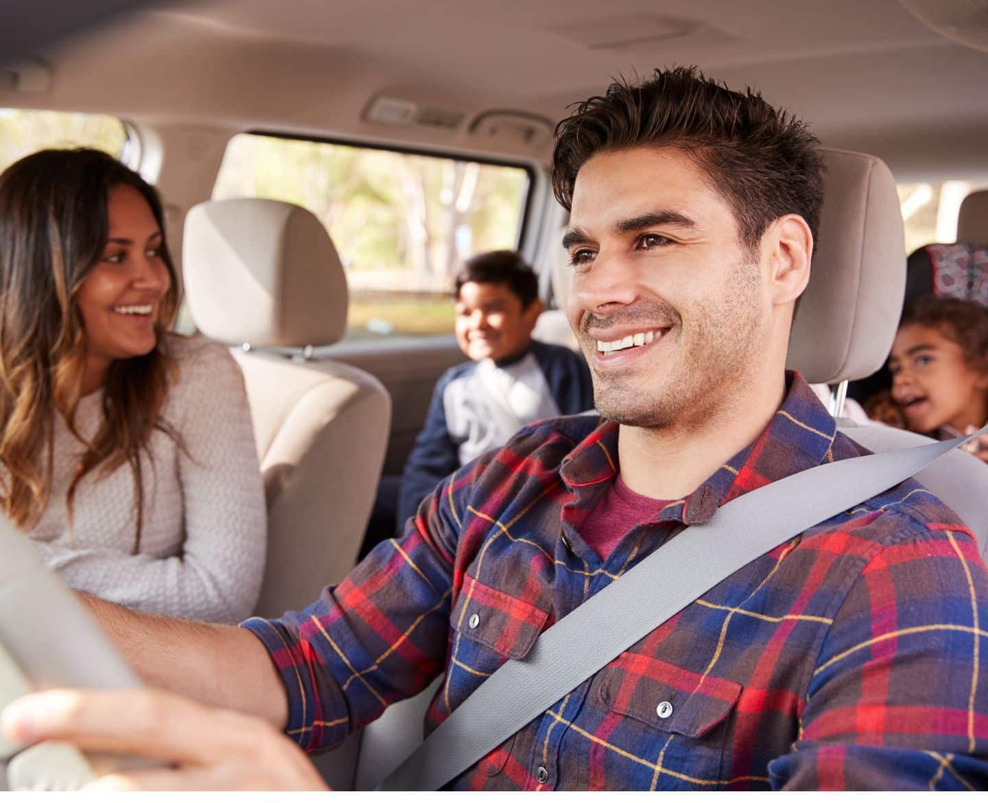 family in a car on a road trip