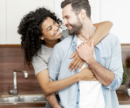 Couple embracing in the kitchen