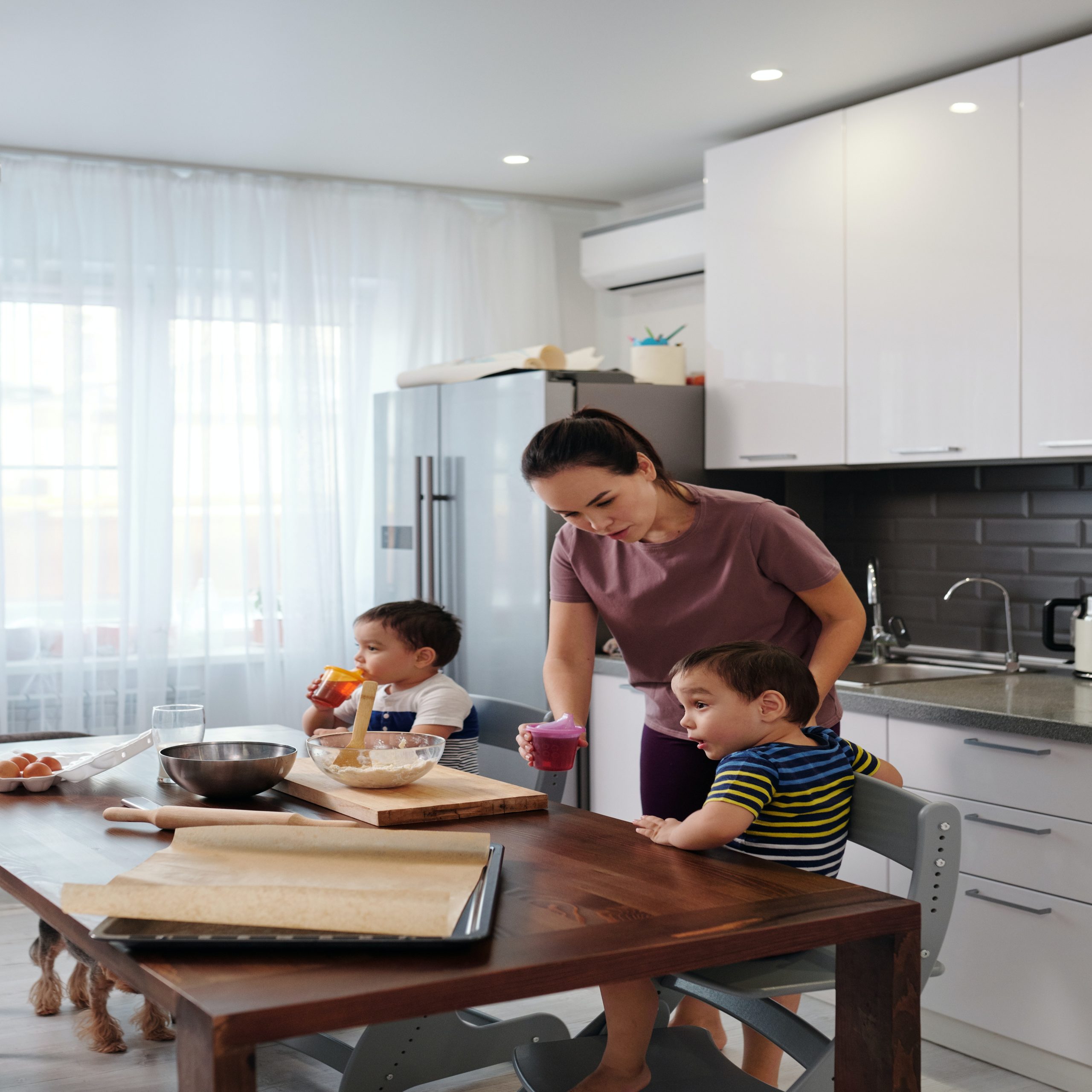 mom feeding boys breakfast