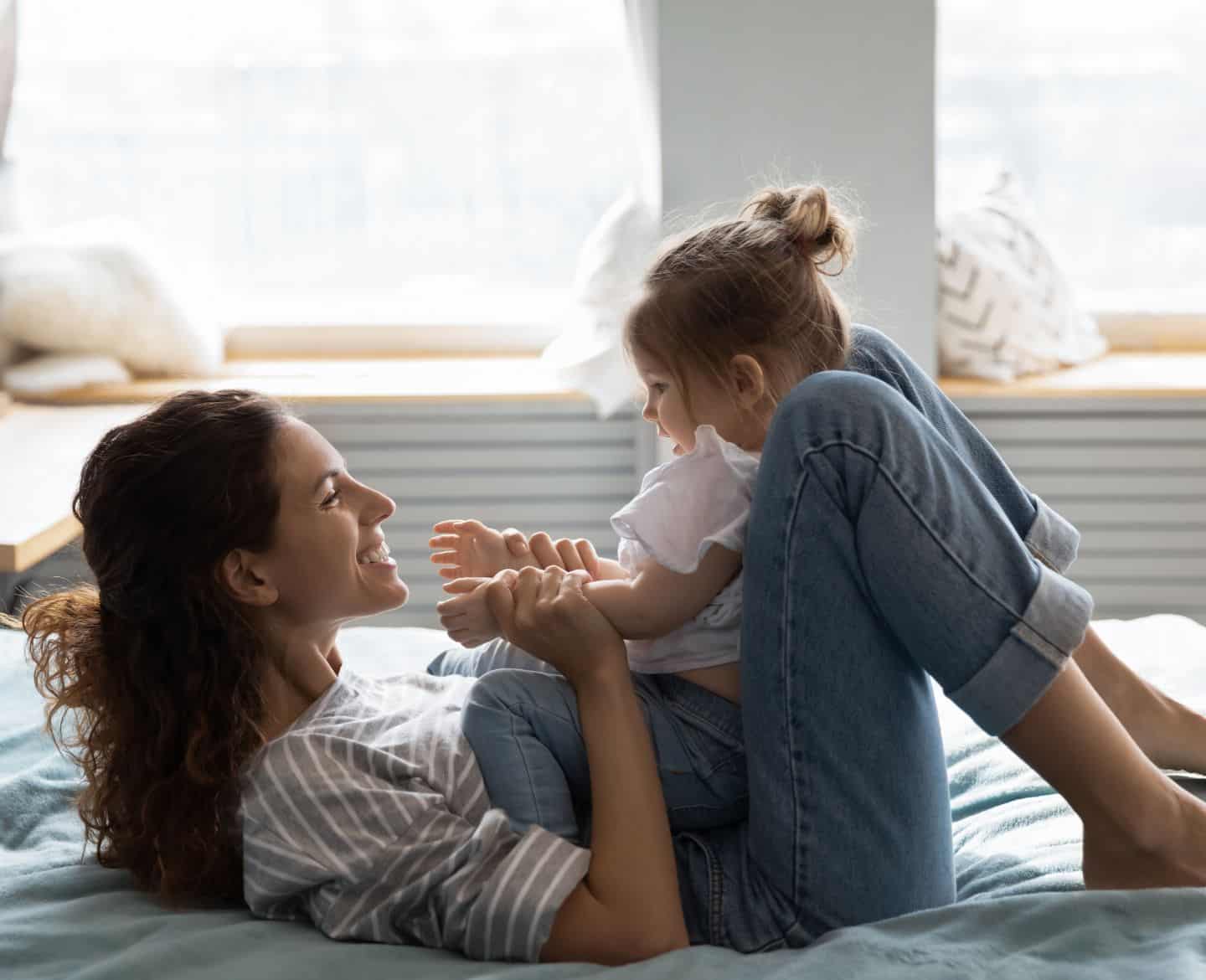 mom playing with happy child