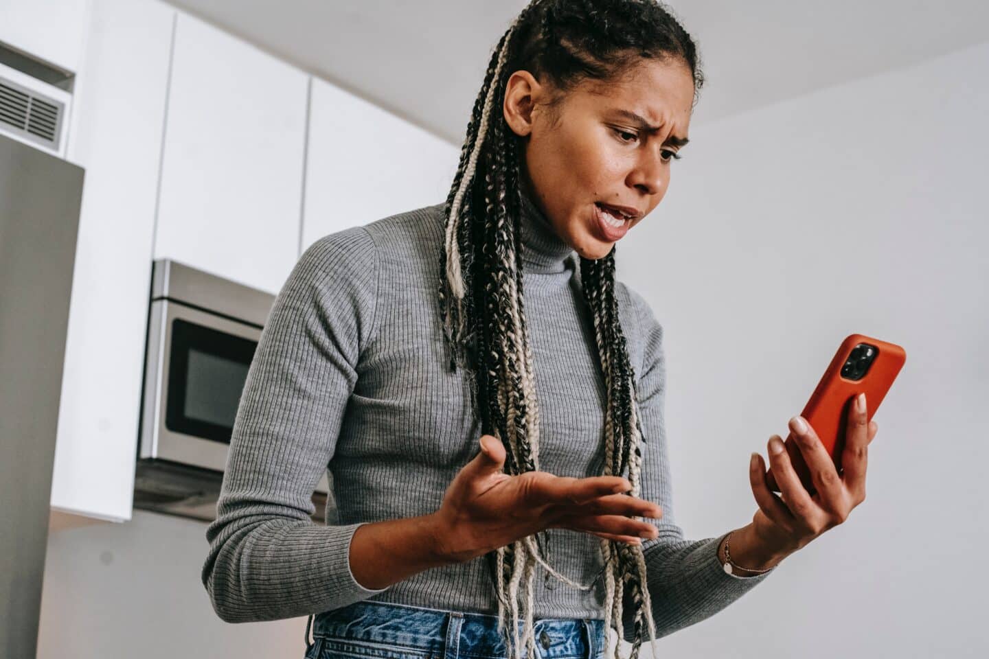 woman angry at iphone