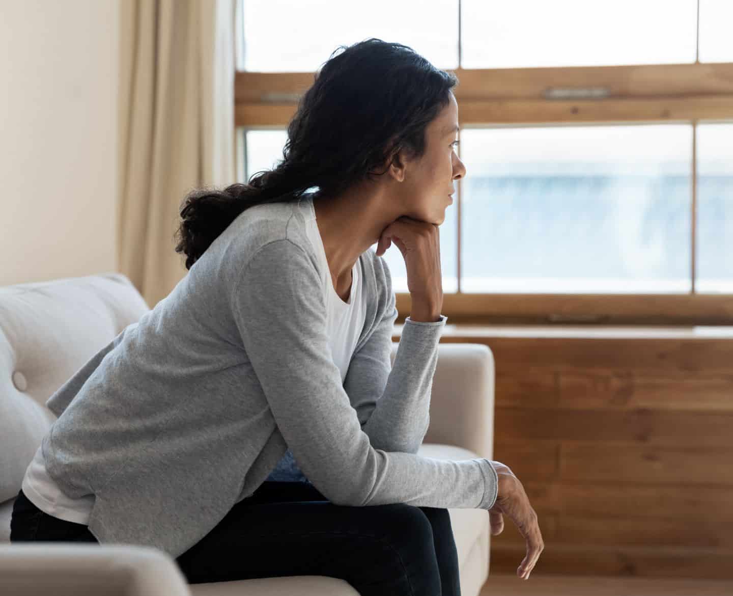 woman looking out window