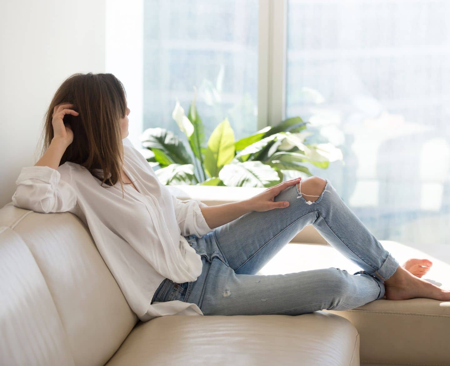 woman sitting on couch