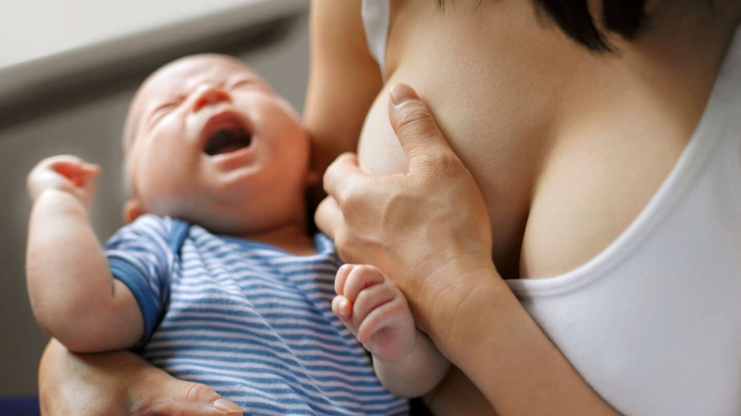 Breastfeeding mom and crying baby