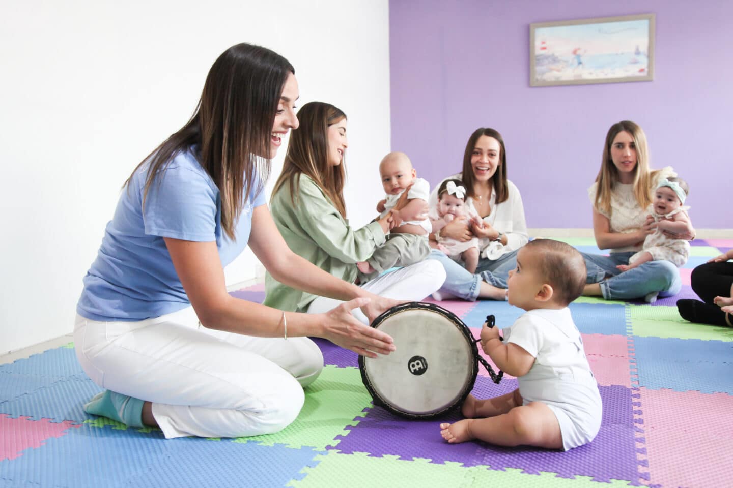 mom and baby playing with instruments in a music together class