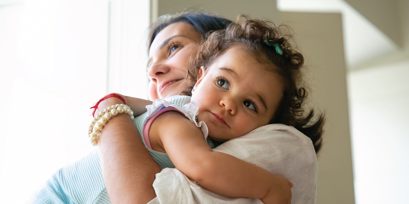 mom hugging little girl - adoption story