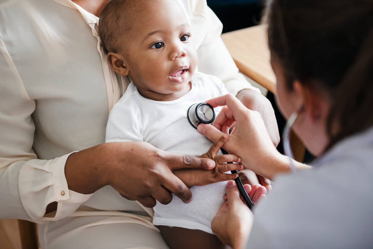 baby getting checked out by a doctor for cancer treatments