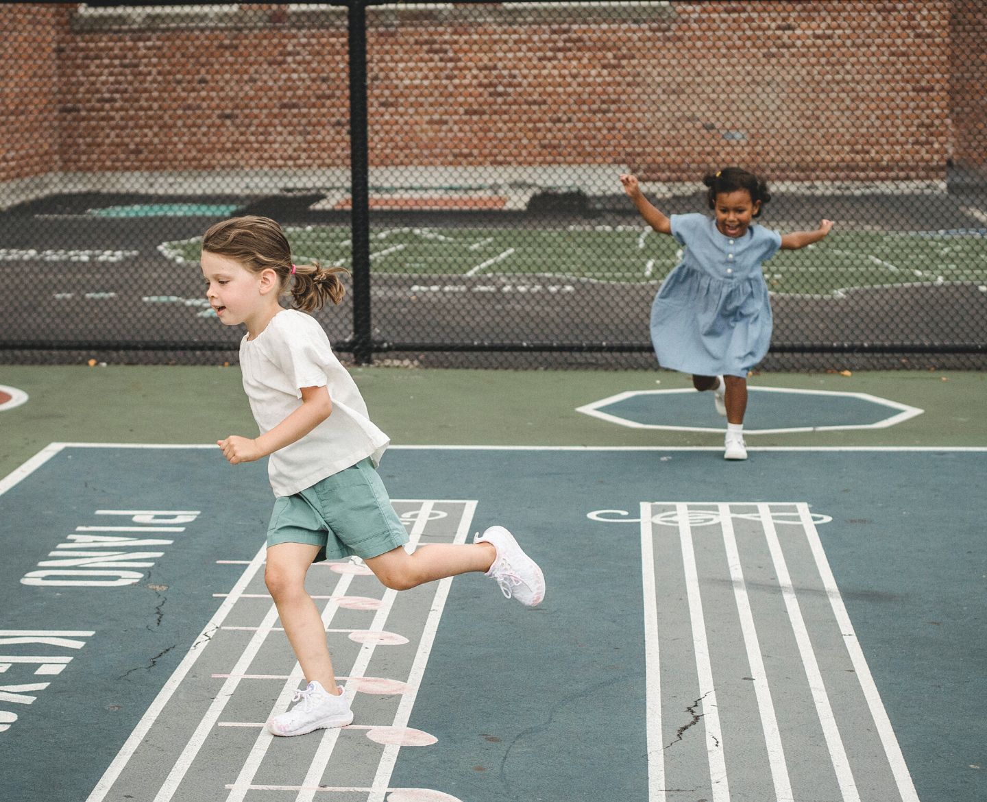 two girls playing outside - let kids be kids