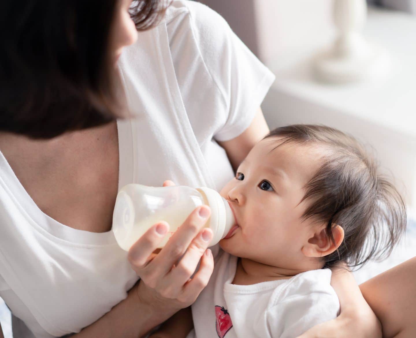 mom giving baby a bottle