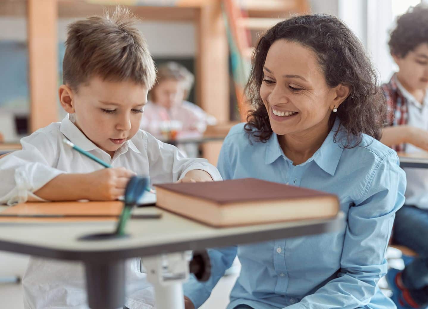 teacher helping student at school