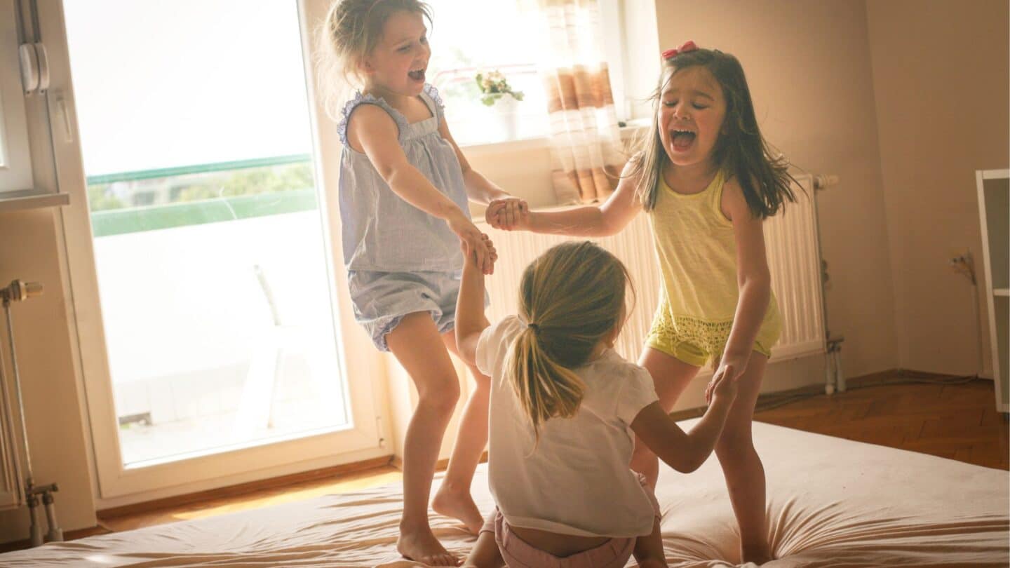 three little girls playing together showing a cousin bond