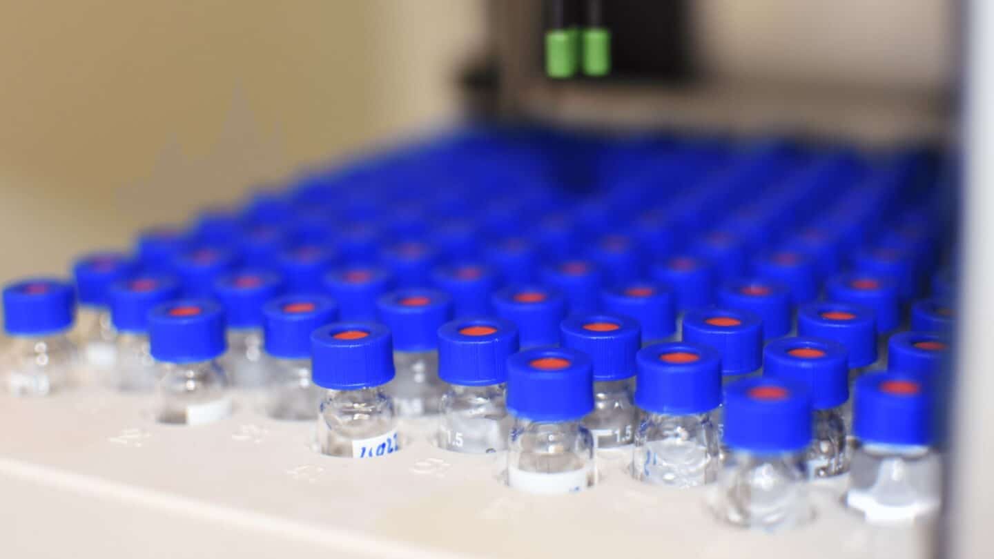 tiny bottles of sample baby formula in a lab