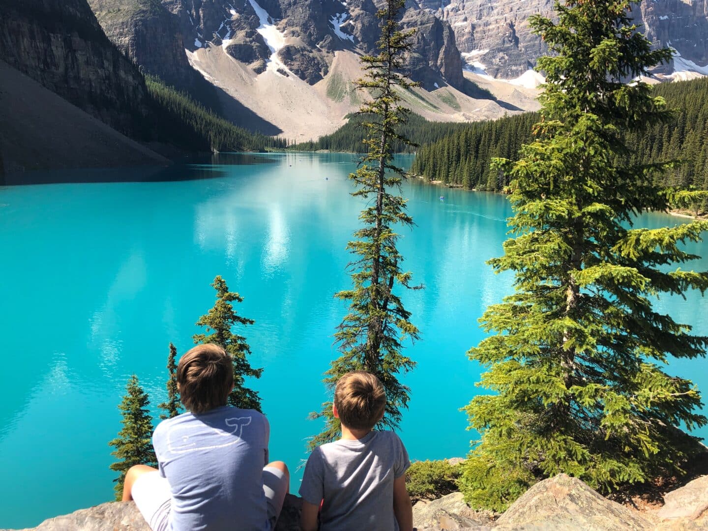 Two boys looking at lake