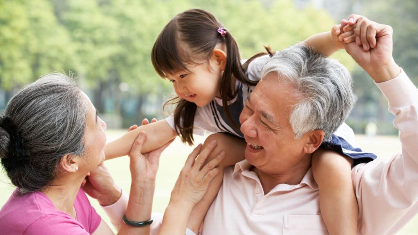 best grandparents ever giving granddaughter ride on shoulders