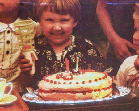 child smiling at birthday party