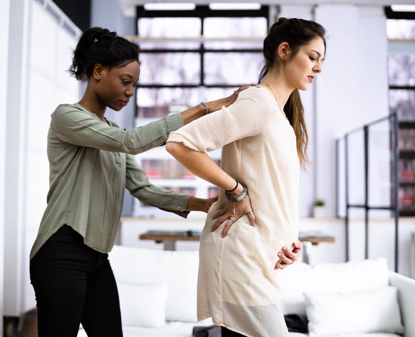 doula assisting pregnant woman